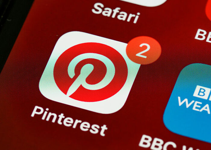 Pinterest app icon with two notifications, representing popular life hacks users swear by.