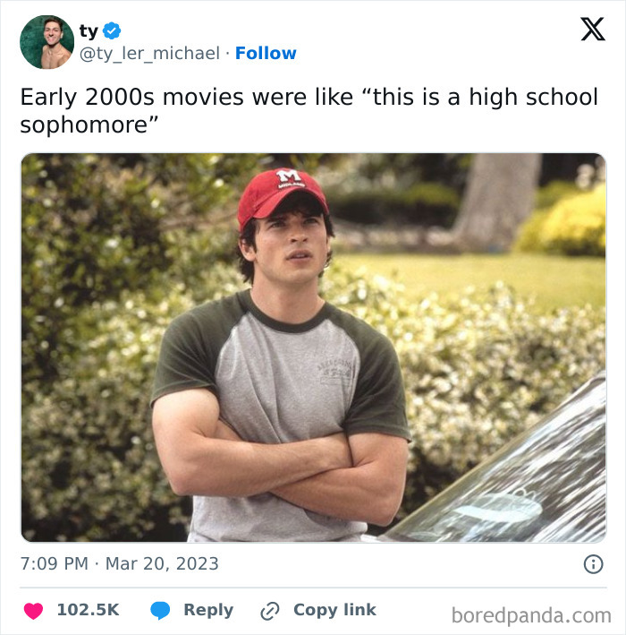 Man in red cap with arms crossed, resembling early 2000s movie character, captures tired millennials meme vibe.