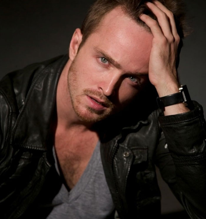 Man in a leather jacket, posing thoughtfully, illustrating a decline in celebrity fame.