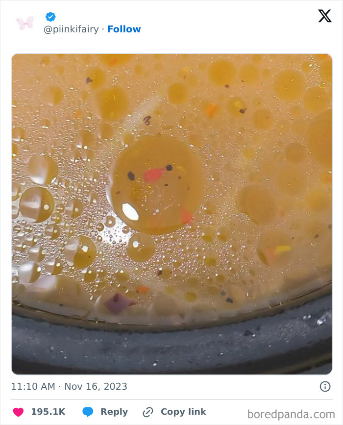 Soup bubbles form a face, demonstrating pareidolia.