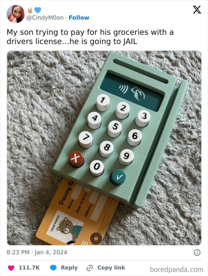 A toy card reader with a driver's license, illustrating dumb-clueless-kids humor.