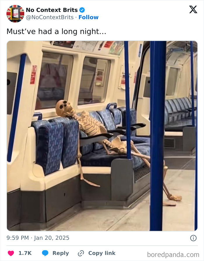 Skeleton sitting on a British train seat, appearing humorous and out of place.
