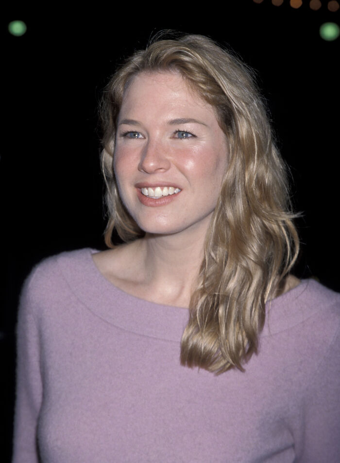 Renée Zellweger in a light-colored sweater in 1998.