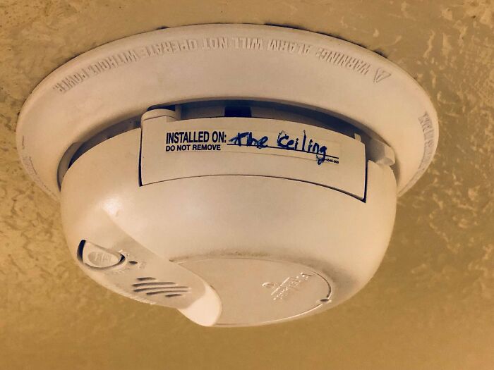 Smoke detector labeled "Installed on the ceiling," highlighting a funny misunderstanding.