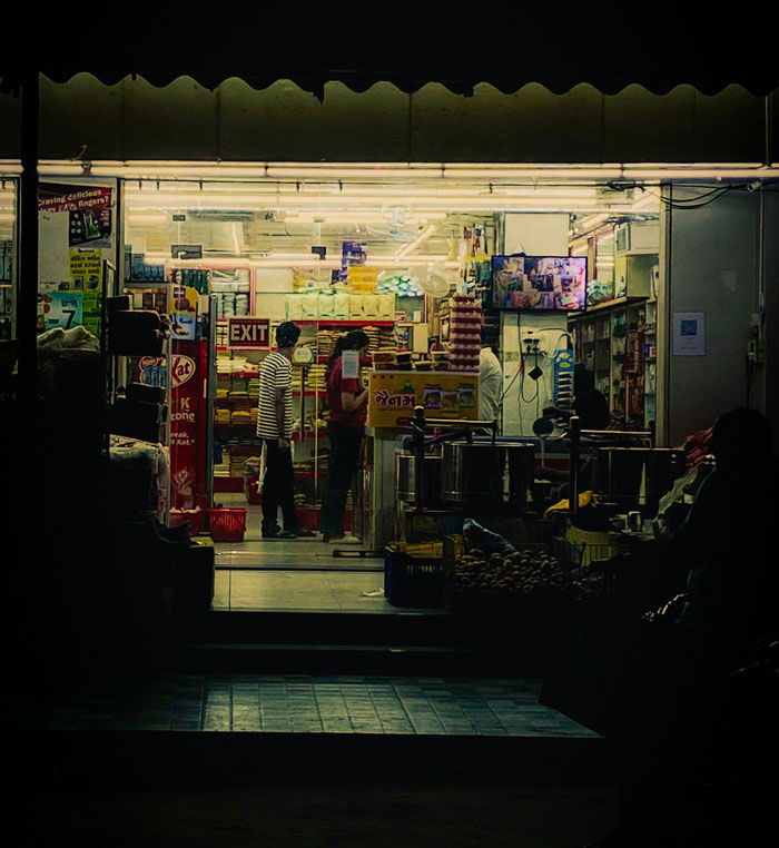 Two people inside a store at night, illustrating stories of people who survived due to another’s sacrifice shared online.