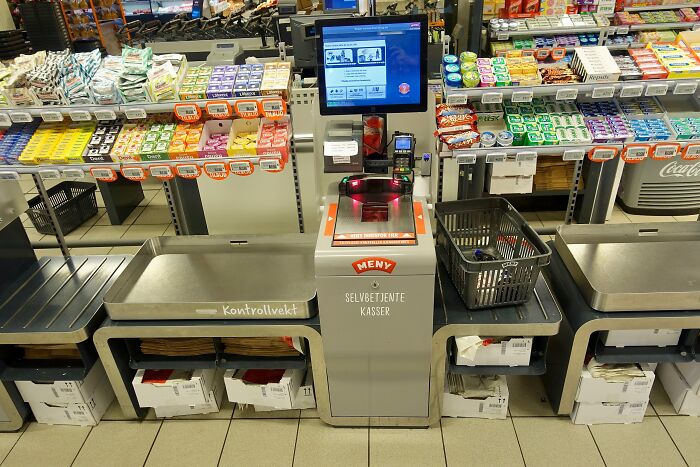 Self-checkout technology in grocery store, modern tech some older people refuse to use.