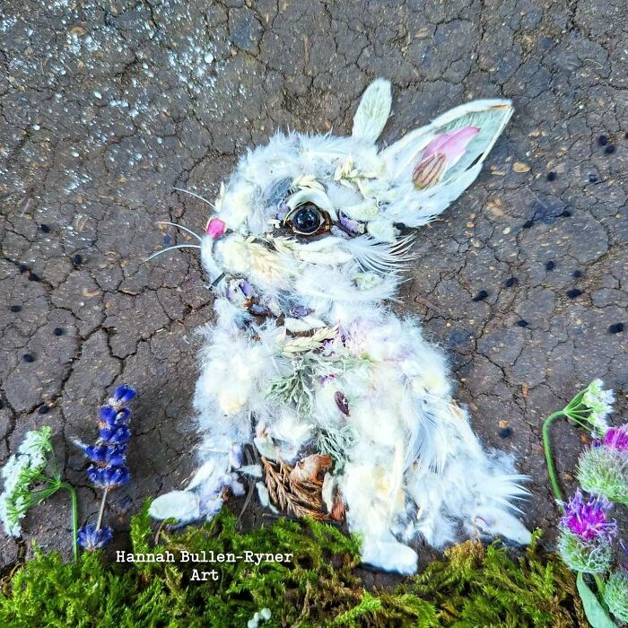 A detailed rabbit portrait crafted from natural materials on c*****d earth, highlighting earth art and nature creativity.