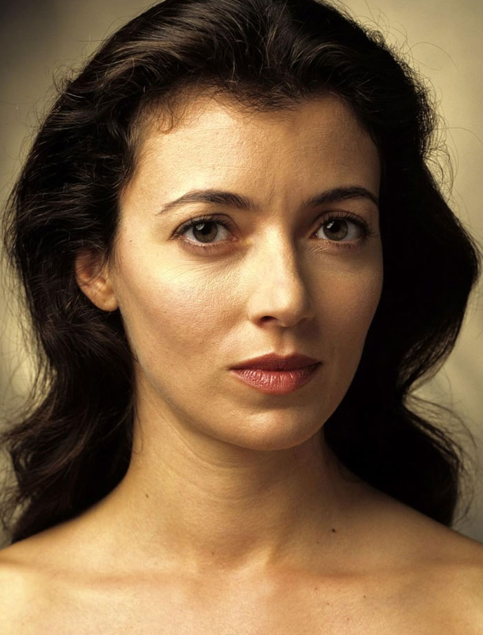 Brunette woman with soft lighting, related to celebrities with fading fame.