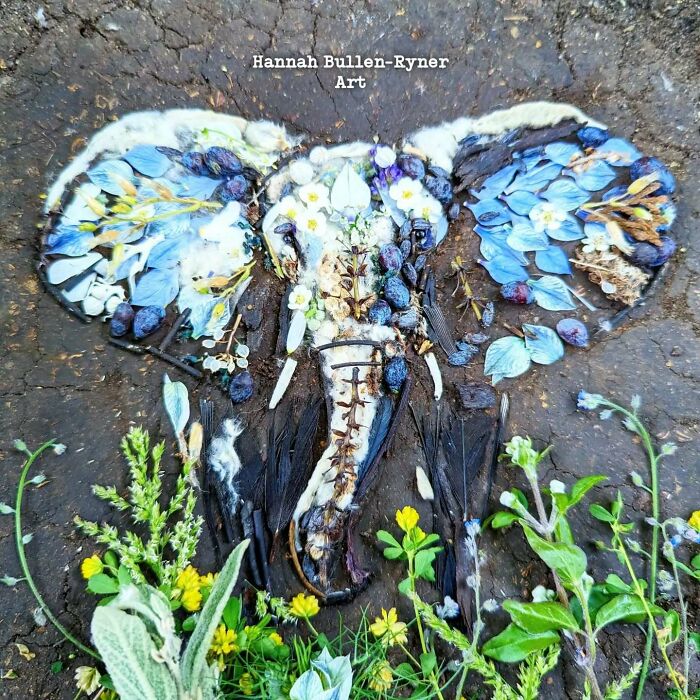Animal portrait using natural materials, showcasing earth art craftsmanship with floral details on an elephant design.