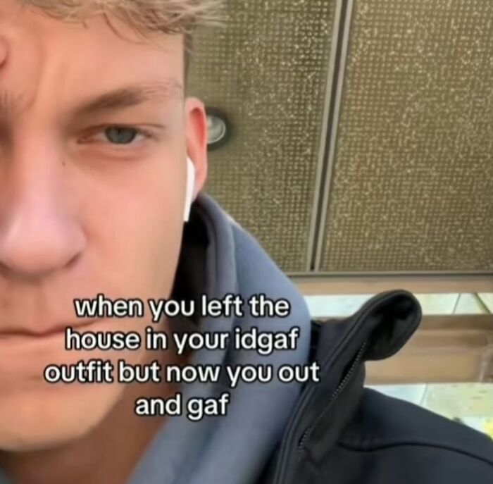 Close-up of a person with text overlay, funny memes mood booster.