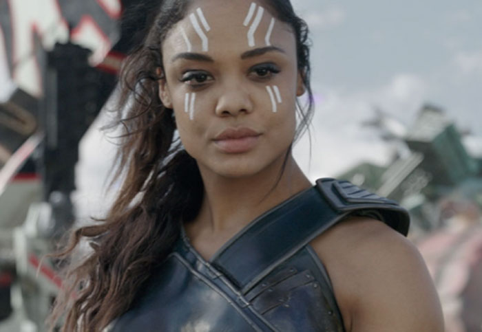 A celebrity in a sci-fi costume with white face paint, embodying a powerful character.