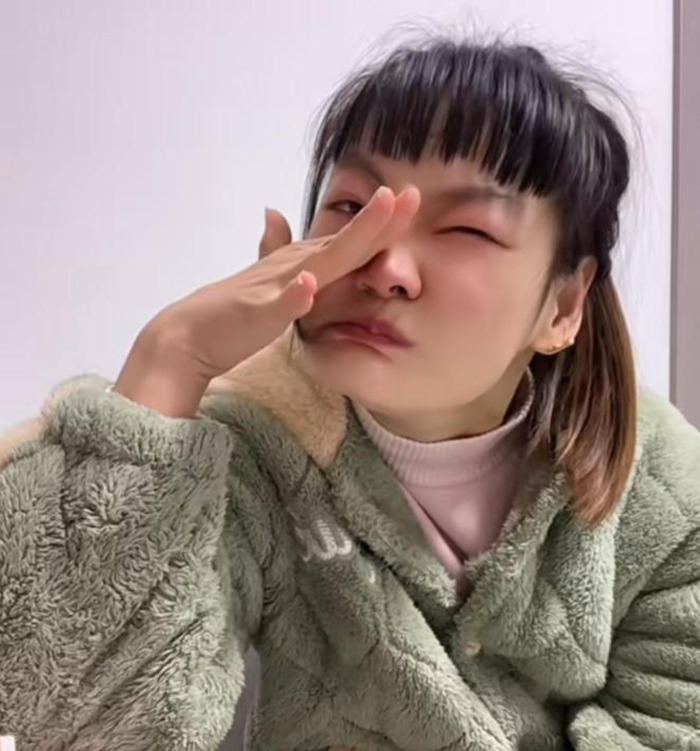 Social media star with cerebral palsy expressing frustration, wearing a green jacket indoors. Social media star with cerebral palsy expressing frustration, wearing a green jacket indoors.