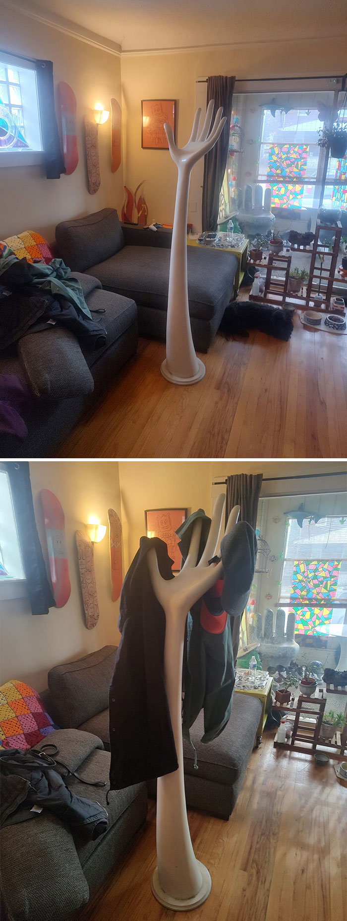 Weird and wonderful secondhand coat rack resembling a large hand in a cozy living room.