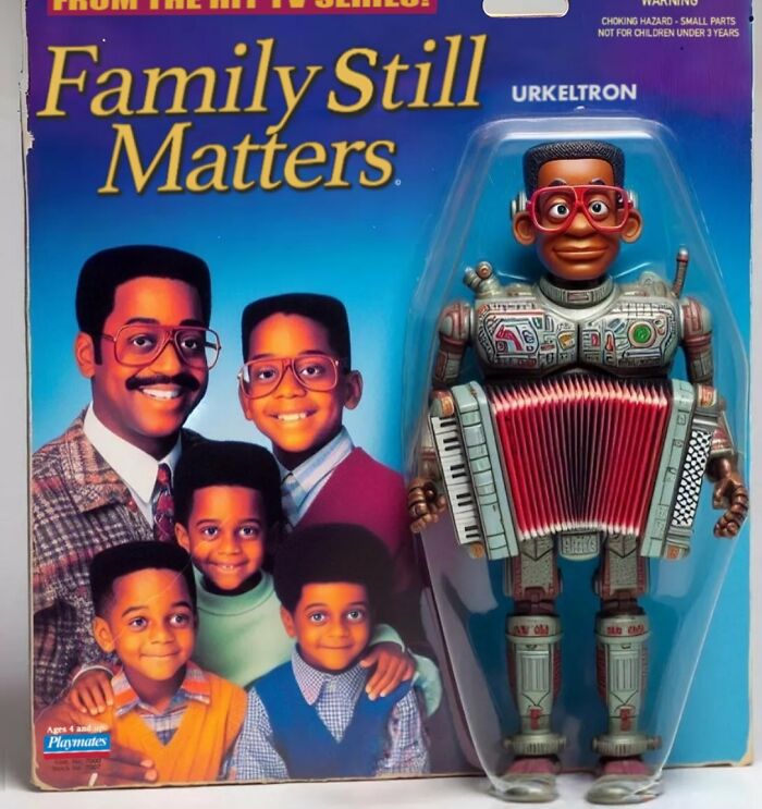 "Controversial toy packaging featuring a robotic figure and a family photo background."