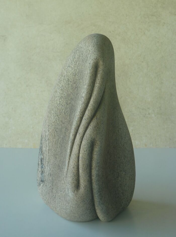 Sculpture resembling soft, flowing fabric, crafted in stone, showcasing a remarkable defiance of physics.