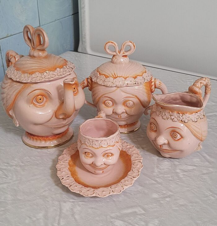 Whimsical ceramic tea set with unique face designs, featured in secondhand finds.