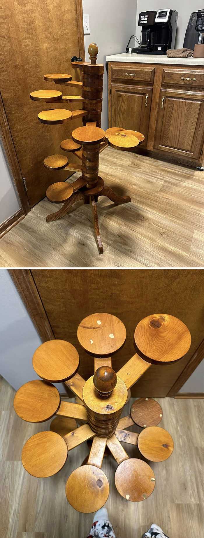 Unique wooden rotating shelf with circular platforms found secondhand, displayed in a kitchen setting.