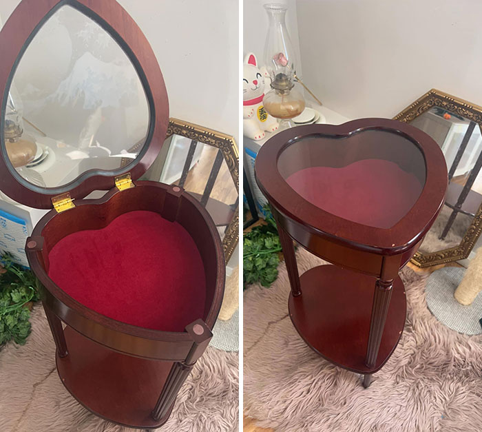 Heart-shaped wooden storage table with a glass top, showcasing a unique secondhand find.