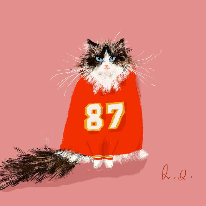 Illustration of a fluffy cat in a red jersey, featuring cozy art for cat lovers by Jamie Shelman.