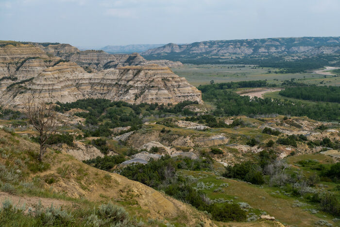 Stunning landscape showing the rugged terrain of a state park with expansive views and lush green valleys.