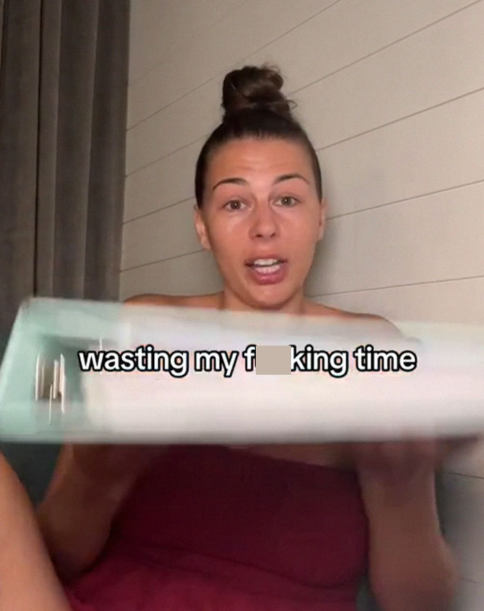 Woman holding a binder, demonstrating a medical binder hack to ensure doctors take her seriously. Woman holding a binder, demonstrating a medical binder hack to ensure doctors take her seriously.