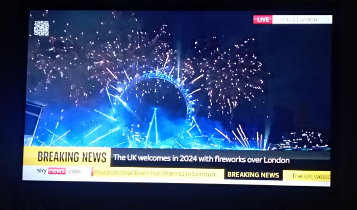 Fireworks over London during New Year's celebration, captured in a live news broadcast showing a preventable fail moment.