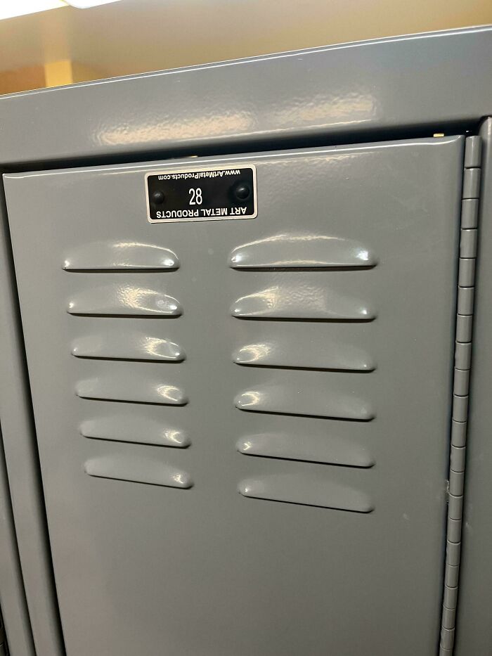Metal locker with a label placed upside down, representing a perfectly preventable fail from one job tasks.