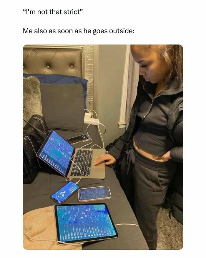 Young woman intensely monitoring multiple devices showing apps, illustrating a funny circle of idiots meme scenario.