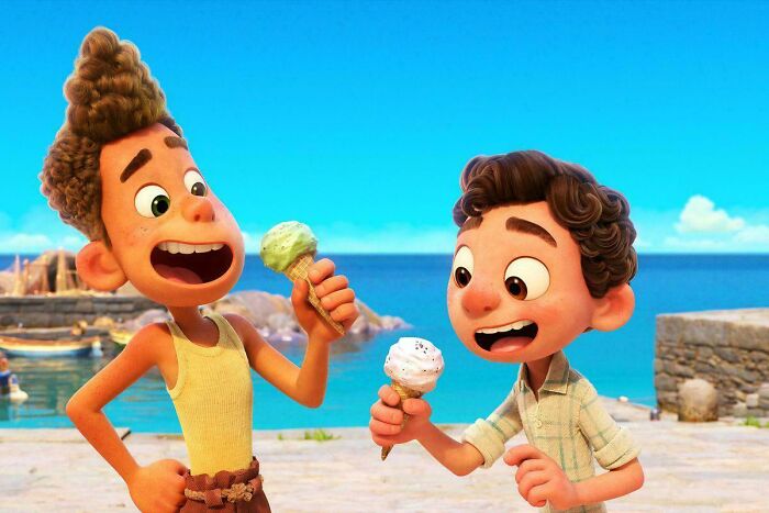 Two animated characters enjoying ice cream cones by the sea, highlighting questionable movie details mocked by cinephiles online.