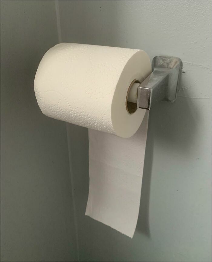 Toilet paper roll installed backwards, a classic sign of horrible roommates.