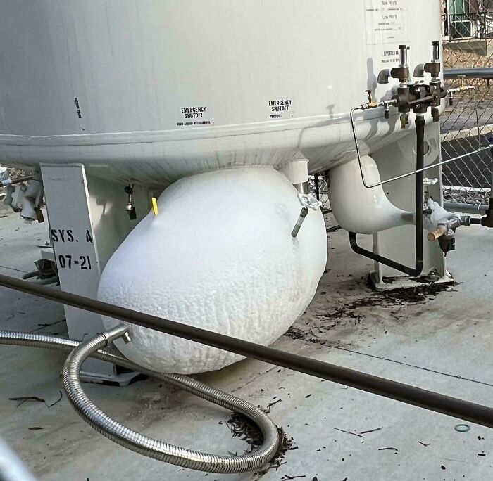 Industrial equipment covered in ice showing ignored safety protocol leading to extremely dangerous conditions.