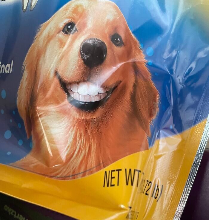 Funny camera roll find: a smiling dog with human-like teeth on a pet food package.