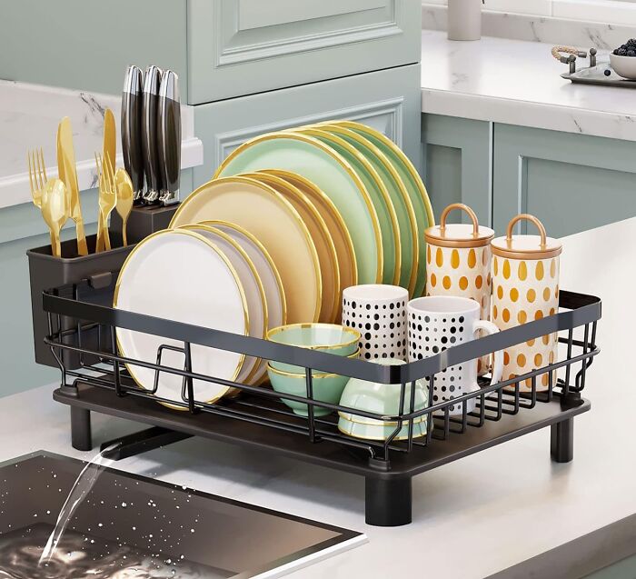 Dish rack with organized clean plates, cups, and cutlery on a kitchen counter promoting operation clean life ideas.