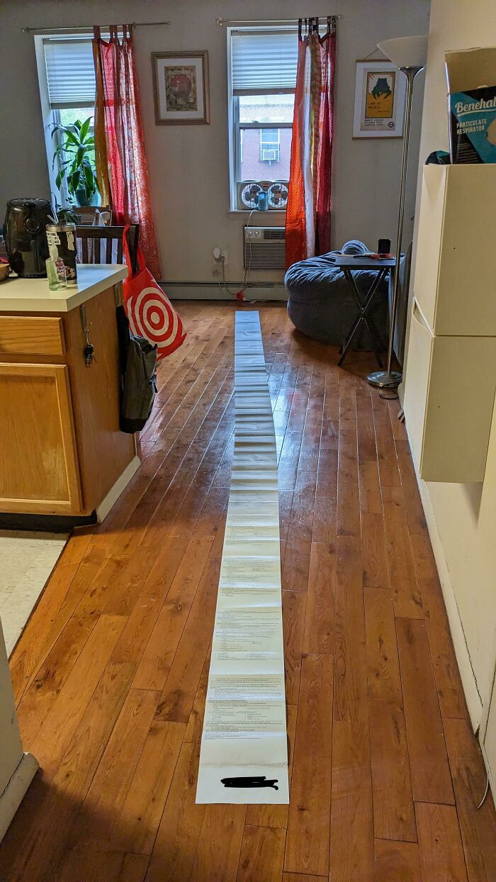 Long pharmacy receipt stretches across a kitchen floor, highlighting infuriating local pharmacies.