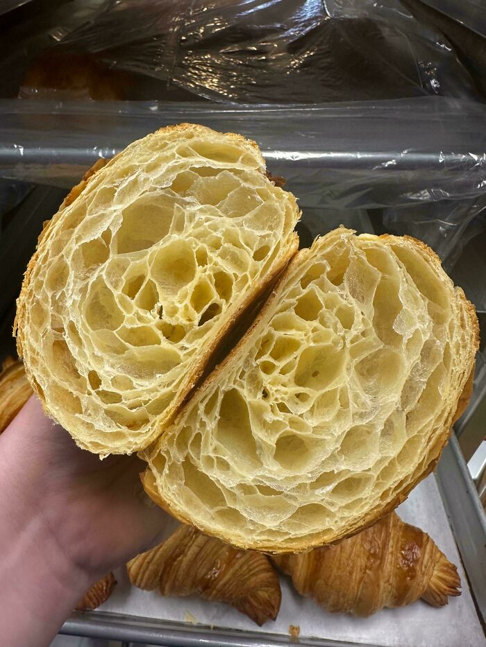 Close-up of a perfectly layered croissant interior showcasing advanced baking techniques.