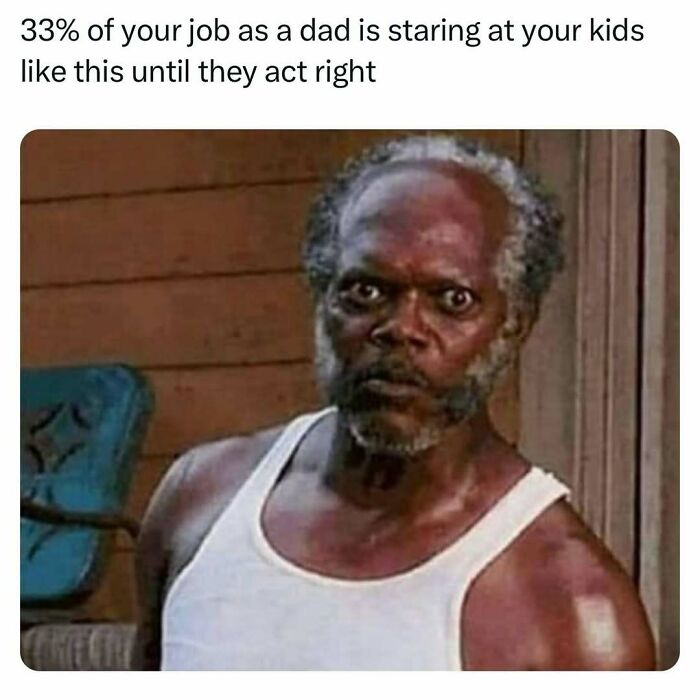 Man in white tank top giving a stern look, showcasing classic dad humor joke.