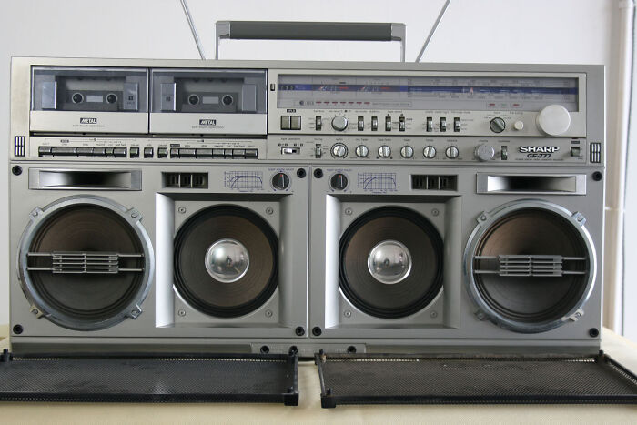 Vintage 80s boombox with dual cassette decks and large speakers, showcasing retro design and nostalgia.
