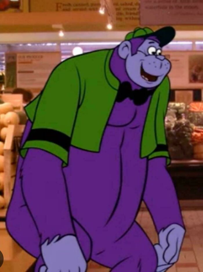 Purple cartoon bear wearing green jacket and cap inside a nostalgic store setting from old animated series photos