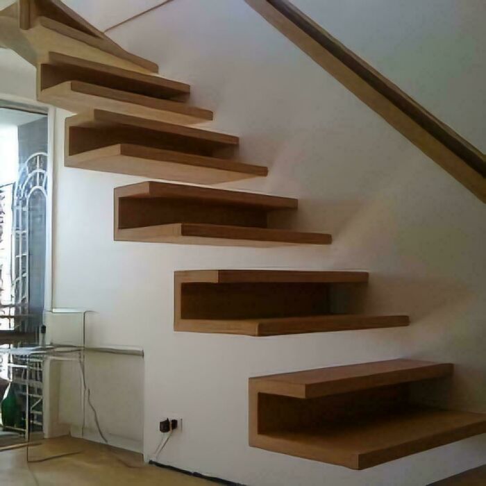 A Modern Floating Staircase With Wooden Steps