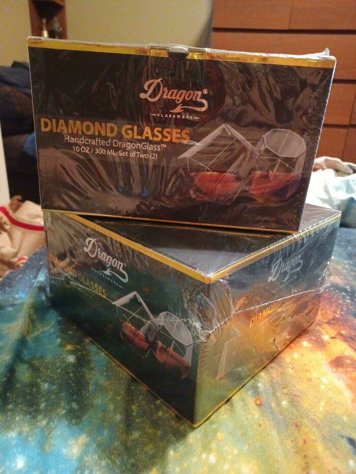 Diamond glass set, perfect for funny wholesome anniversary surprises, elegantly wrapped on a colorful surface.