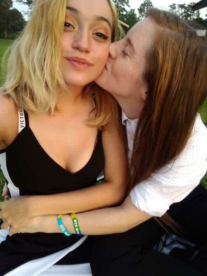 Two people showing affection outdoors, capturing the essence of long-distance love.