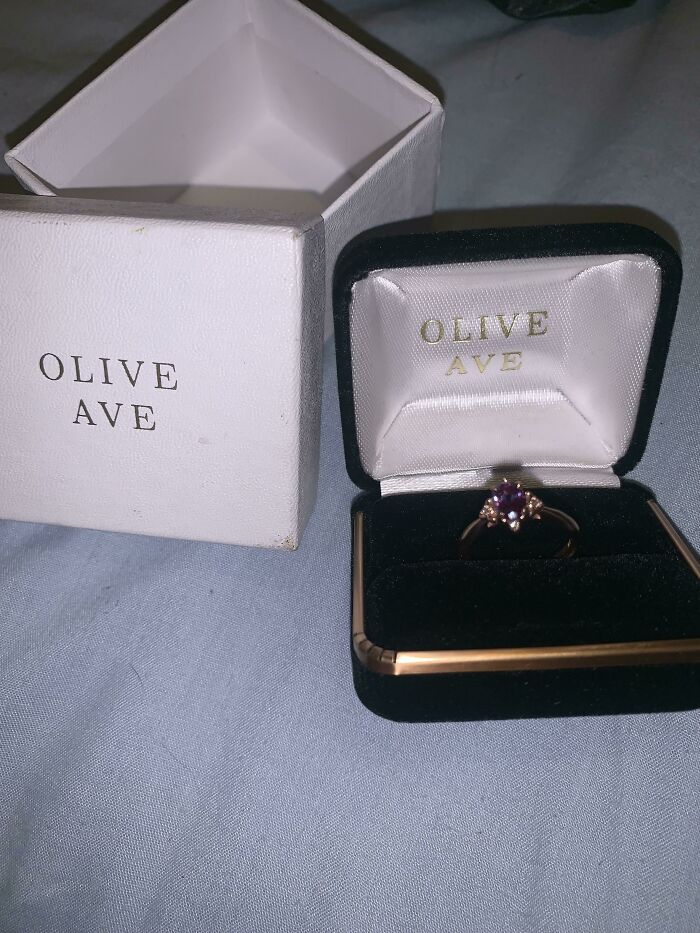 Ring with amethyst stone in Olive Ave box, symbolizing long-distance love enduring challenges.