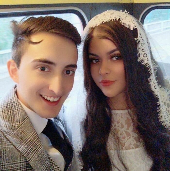 Couple in love posing for a selfie, the woman in a bridal veil, representing long-distance love.