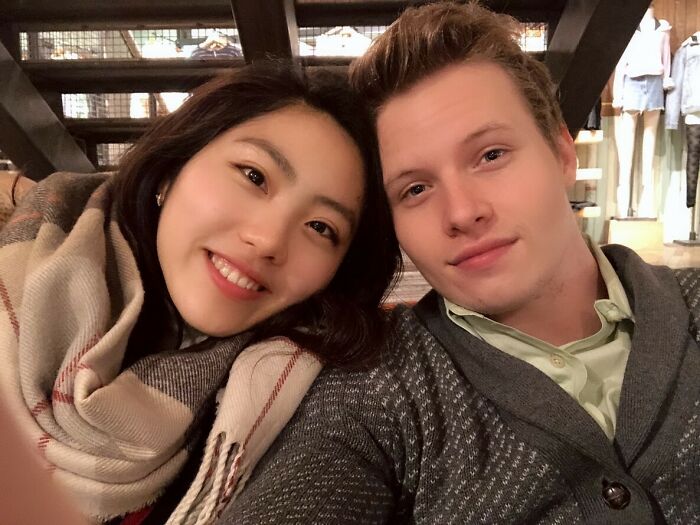 Smiling couple proving love wins in a cozy setting with intimate ambiance.