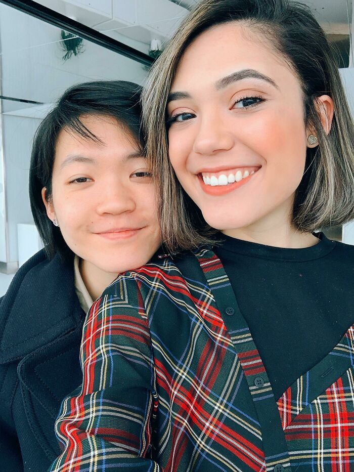 Two people smiling together, capturing a joyful moment of long-distance love.