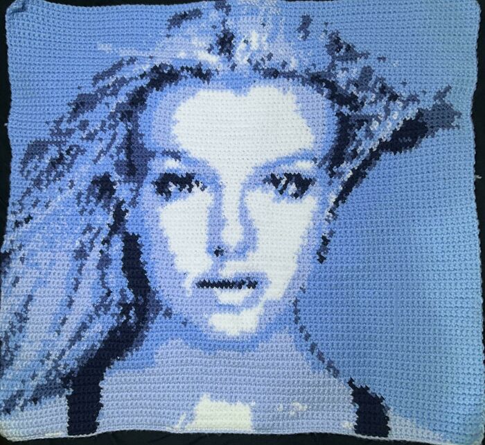 Crochet enthusiasts created and shared a detailed crocheted portrait showcasing their proud crochet projects.