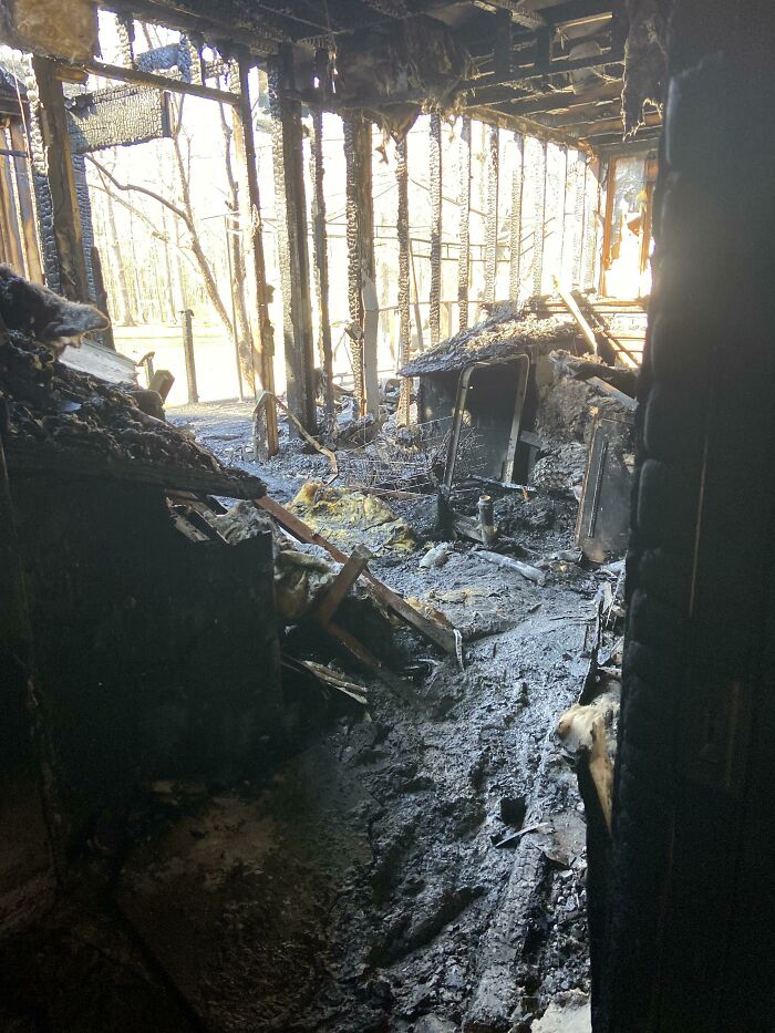 Burned interior of a building, showcasing damage and highlighting nature disaster resilience needs.