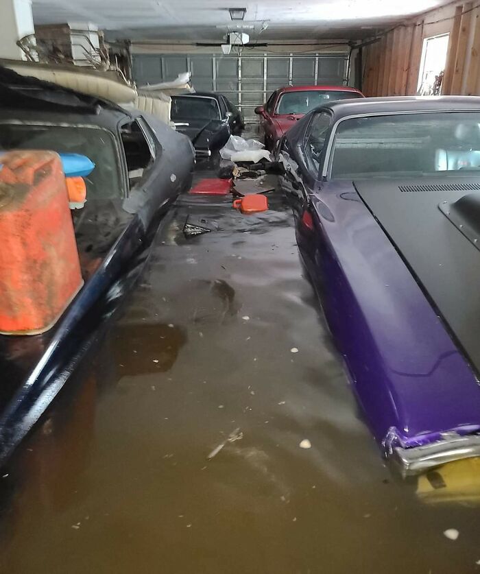 Flooded garage with submerged cars illustrating challenges in nature disaster resilience.