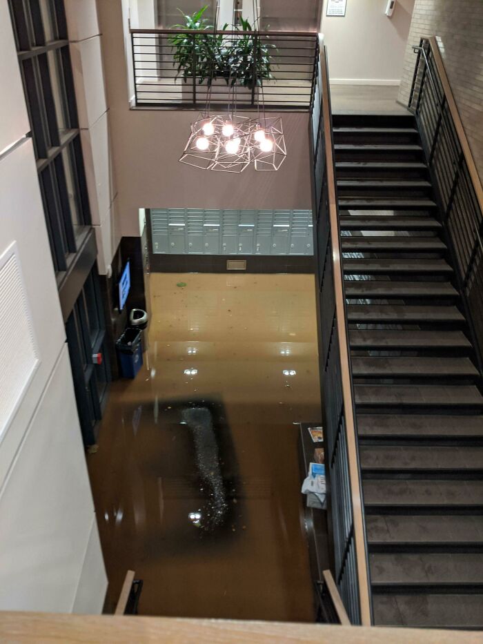 Flooded building interior highlighting nature disaster resilience challenges.