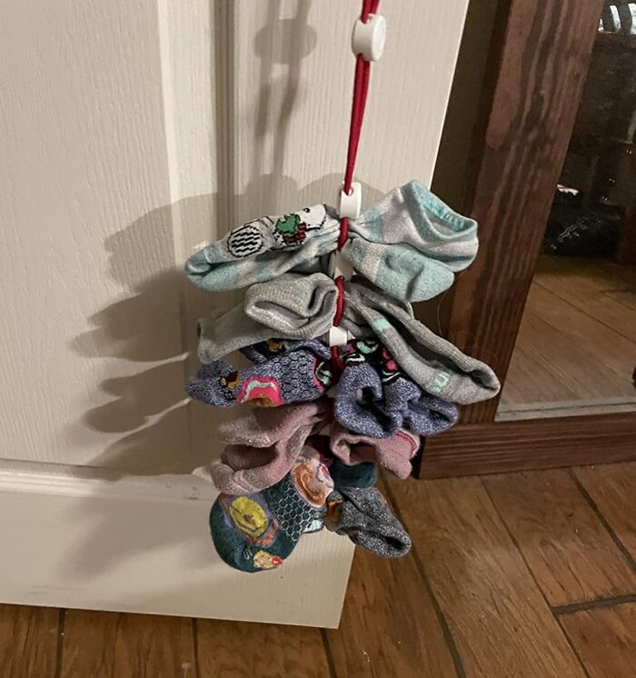 Colorful socks neatly organized on a vertical hanger, enhancing a put-together feel in 2025.